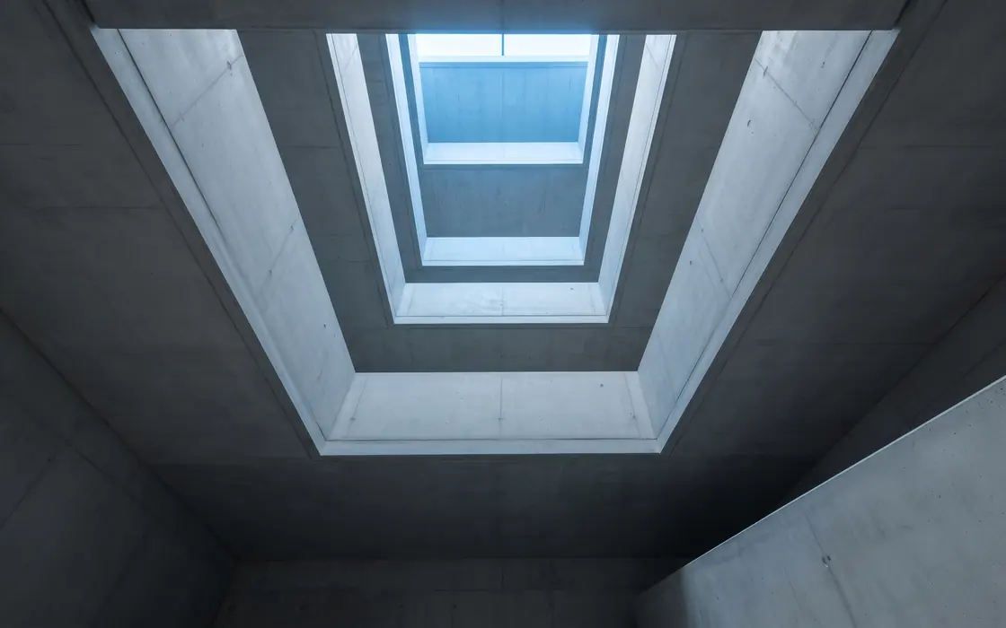 A stairwell, each level brighter than the one below